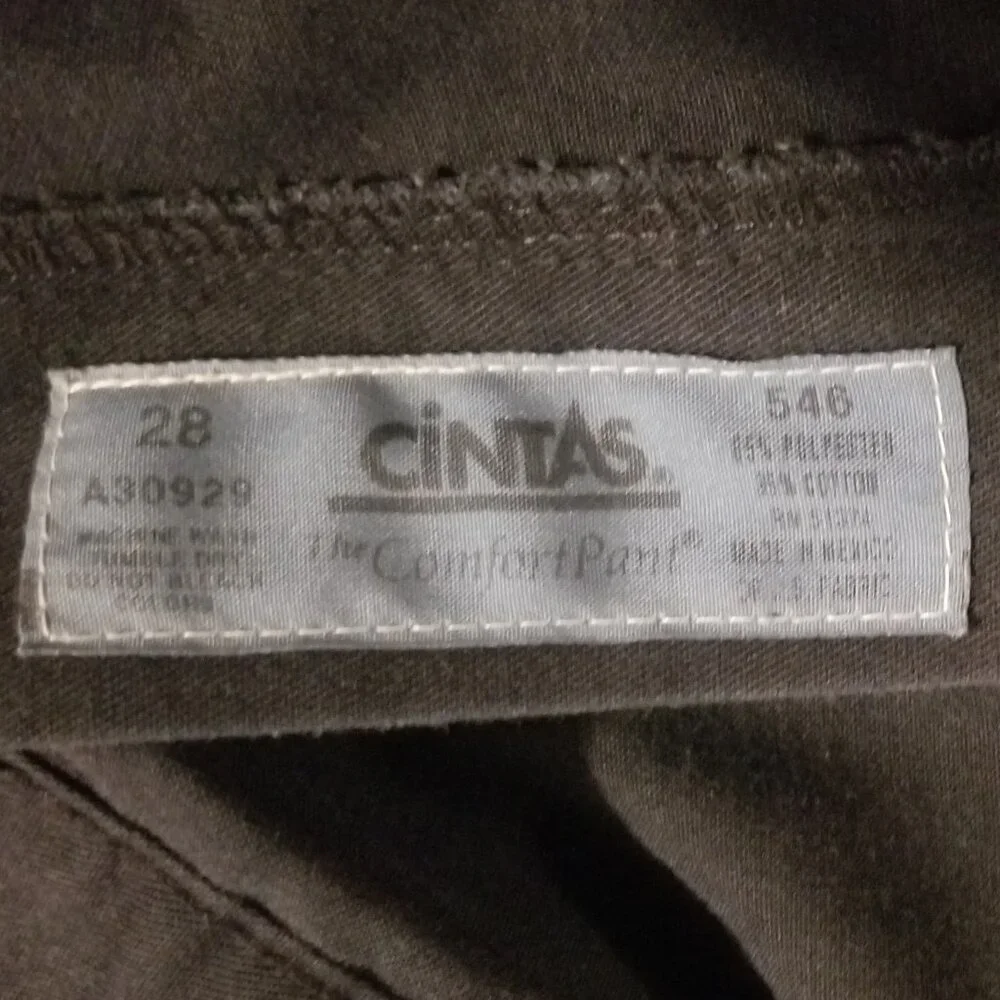 Three stained Cintas men's pants with stretching waistbands